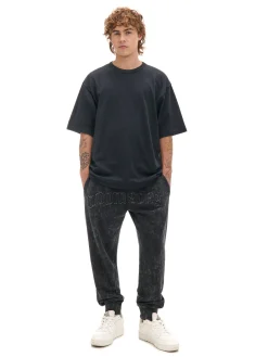 Spodnie joggery regular z napisem